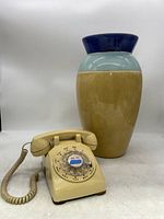Full overview of rotary phone and tall vase showing size and color