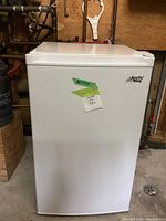 Front exterior view of freezer with brand logo and lot sticker on door.