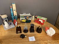 Overview of vintage Avon collectible bottles and decanters with several original packaging boxes, assorted designs including animals and objects