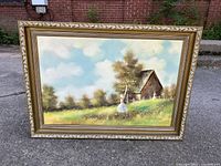 Full view of the framed painting showing barn and foraging women in a rural landscape.