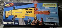 Front view of the Nerf Fortnite AR-L box showing the yellow motorized dart blaster, Fortnite logos, and characters.