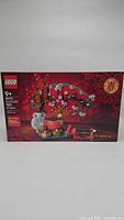 Front view of LEGO Good Fortune set box showing assembled display of 1021 pieces featuring symbols of good fortune and Chinese New Year celebration.