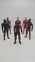 Front view of six Marvel superhero action figures arranged in two rows, showing Star-Lord, Black Panther, Spider-Man, Captain America, Iron Man, and Falcon.