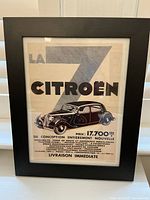 Framed vintage-style print featuring a Citroen La 7 car advertisement in French, showing full print and frame.