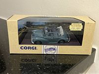 Front view of the boxed blue Corgi English Morris convertible model car showing box and car details.