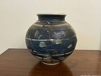 Front view of the decorative ceramic vase showing the abstract design.