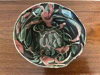 Top view of bowl showing detailed abstract glaze pattern in multiple colors.