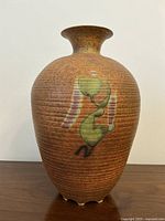 Full front view of ribbed vase with abstract pattern