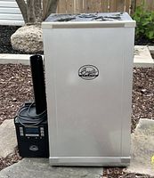 Front view of Bradley electric smoker and digital smoke generator unit