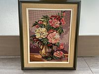 Full view of the framed floral needlepoint showcasing the arrangement and frame style.