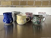 All six porcelain pieces arranged in a row