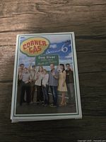 Top view of the full deck box showing the cast of Corner Gas Season 6 and Dog River town sign.
