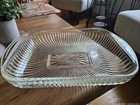 Top angled view of the vintage thick glass lasagna dish showing starburst pattern and ridged sides