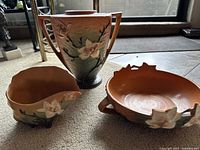 All three pieces shown together on carpeted floor under natural light