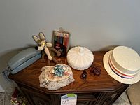 Photo showing all items arranged on a wooden dresser surface