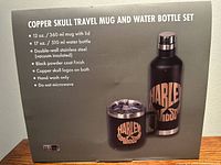Photo of the front of the box showing product image and details listing mug and bottle sizes, material, finish, and care instructions.