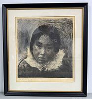 Framed monochromatic print of Inuit child wearing fur-lined hood in black frame with matting.