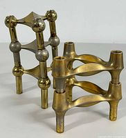 Two assembled stacks showing one 7" tall stack and one 5" tall stack in brass and silver finish.