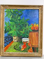 Full view of the framed painting showing the still life composition including green potted plant, goldfish in glass bowl, stacked cups, and pears on cabinet.