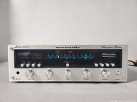 Front view powered on showing illuminated tuner scale and control layout