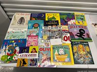 Overview of 20 children's books arranged in rows showing colorful covers and titles.