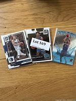 Photo showing three basketball cards including Luka Doncic, Wendell Moore Jr., and Devin Booker Splash template