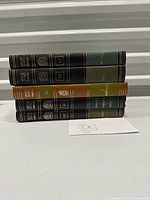 Stacked set of five hardcover books from the Britannica Great Books of the Western World series, volumes 25 through 29.