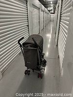 Full side-rear view of Silver Cross Zest umbrella stroller with charcoal gray fabric and ergonomic handles