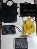 Top view showing all five bags arranged on a white surface.