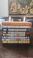 Stack of 8 books from Diary of a Wimpy Kid series and one related title by Rowley Jefferson, showing spines with titles and author names.