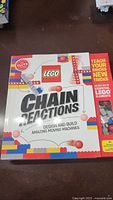 Front view of the new unopened Lego Chain Reactions boxed set showing colorful packaging and branding.