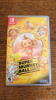 Front of the Nintendo Switch game case for Super Monkey Ball Banana Blitz HD showing cover art with cartoon monkeys and banana graphics