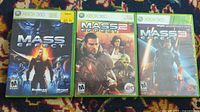 Three Xbox 360 game cases for Mass Effect 1, 2, and 3 showing front cover art.