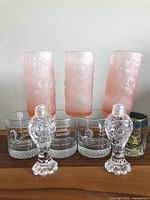 Full lot of 7 glasses and 2 glass salt and pepper shakers displayed together
