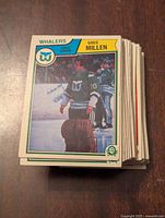 Front view of a hockey card featuring Greg Millen in Whalers uniform.