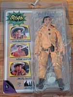 Front view of unopened Swamp Thing action figure from Batman Classic TV Series in original packaging showing figure's full body and packaging graphics.