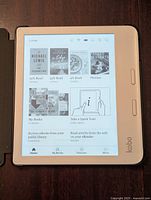 Kobo Libra 2 eReader in protective folio, powered on