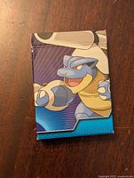 Front side of the deck box showing Mega Blastoise artwork.