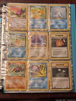 First page of the binder with 9 Pokemon cards and 2 Trainer cards in plastic protector sleeve, featuring Porygon, Psyduck, Seel, Magikarp, Dragonair, Kabuto, Tentacruel.
