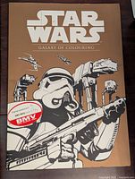 Front cover of Star Wars Galaxy of Colouring book showing Stormtrooper and AT-AT walkers with logo