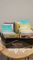 Close-up photo of the collection with visible labels '09-16' and 'Steam Siege + XY' on the card stacks