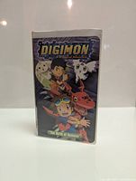 Front view of Digimon VHS tape case showing cover artwork and title