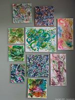 Photo showing all 10 original abstract paintings in the Green Collection by Jose Laberge arranged on a wall.