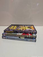 Stacked DVDs showing spines: Scooby-Doo and the Ghoul School on top, then 6teen Deck the Mall, then 6teen Employee of the Month.