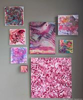 View of 8 original abstract paintings hung on a wall showing varied sizes and pink-themed color palettes by Jose Laberge.