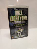 Front view of sealed VHS tape case showing the Buzz Lightyear of Star Command: The Adventure Begins cover with Tim Allen credited.