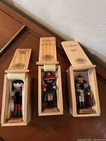 Three Steinbach mini wooden nutcrackers in original wooden display boxes with foam padding