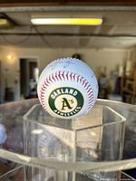Baseball showing the Oakland Athletics logo on one panel.