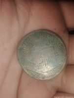 Obverse side of the 1844 Montreal token showing worn but partially legible inscriptions including 'Montreal' and 'Province of Canada'.