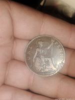 Reverse side showing Britannia seated with trident, shield, and denomination 'ONE PENNY' with date 1917.